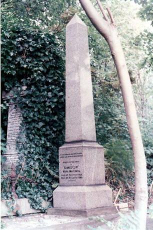 Akmens obelisks dārzā ar uzrakstu, kas piemin Eliotu